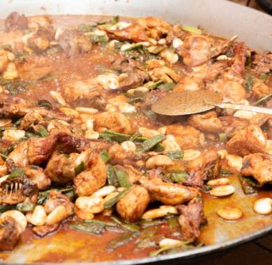 preparing Traditional Spanish Paella Valenciana